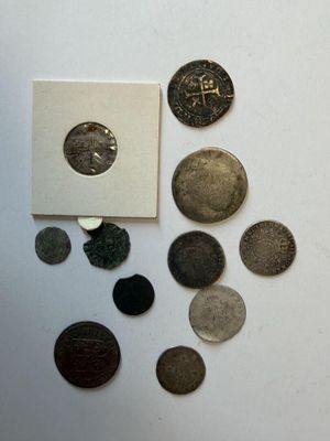 a lot of coins that are sitting on a table