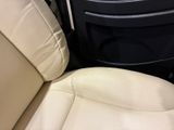 a seat in the back of a car with a remote control