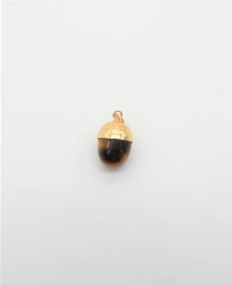 un gland plaqué or orné d'une pierre noire