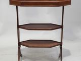 a three tiered wooden table with a glass top