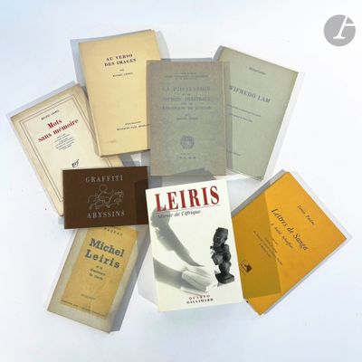 a pile of books that are sitting on a table