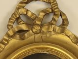 a gold frame with a painting of flowers on it