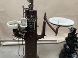 an old fashioned fire hydrant with a plate on top of it