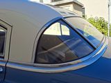an image of a blue car parked in front of a building
