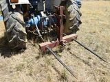 a tractor that is sitting in the grass