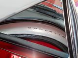 a close up of a car ' s rear window with the word corvette written on it