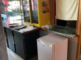 an image of a kitchen area with a refrigerator and a sink