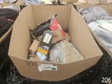 a cardboard box filled with assorted items in a room