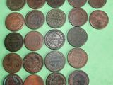 a lot of coins that are on a green surface