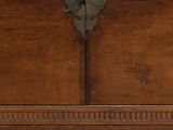an old wooden chest sitting on top of a wooden table