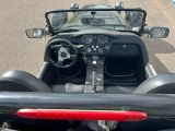 a view from the back seat of a car driving down the road