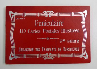 panneau rouge et blanc sur un mur blanc, avec l'image d'un cadre