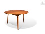 an image of a small round table with a wooden top