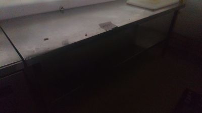 a sink in a bathroom with a mirror above it