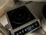 a stove top that is sitting on a counter