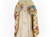 an old statue of a woman with a crown on her head
