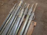 a lot of pipes that are stacked up on a pallet