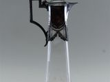 a glass pitcher with a handle on a white background