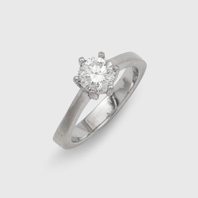 a close up of a diamond ring on a white background