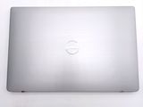 dell laptop computer sitting on top of a white table with a logo on the screen