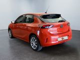 the rear end of a red toyota prius parked in a showroom