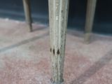 a close up of a table with a vase on top of it
