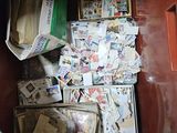 a box full of mail sitting on the floor