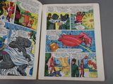 two pages of comics are open on a table