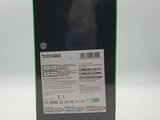 the back of a black box with a green and white label on it