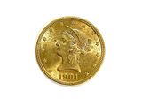 a close up of a gold coin on a white surface