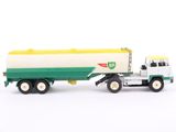 a toy truck with a tanker on the back of it