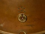 an image of a close up of a copper pot