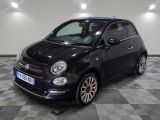 la photo d'une petite voiture noire garée dans un garage