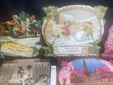 a lot of vintage christmas cards and other items on the table