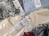 many different types of clothing on display in the store