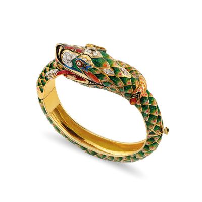 a close up of a snake bracelet on a white background