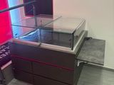 a display case with a glass top in a room