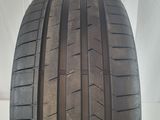 a close up of a tire on a white surface