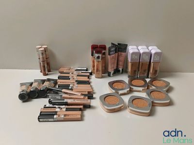 a close up of a table with a lot of makeup on it