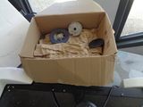 a cardboard box that has a pair of scissors in it