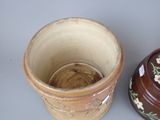 two vases sitting next to each other on a table