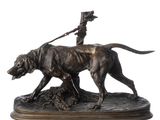 bronze statue of a man on a horse with a dog