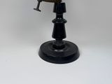 an image of a clock that is on top of a table