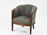 an upholstered chair with a wooden frame and upholstered seat