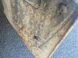 a close up of a metal object on the ground