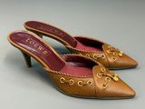 an image of a pair of women ' s shoes on a gray surface