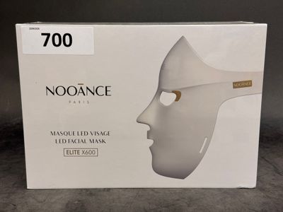 a box with a white mask on top of it