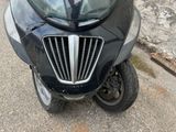 a motorcycle that is parked on the side of the street