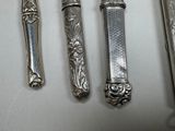 four spoons and a fork on a table