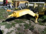 a yellow machine that is sitting in the grass